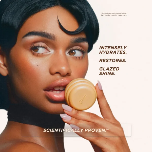 Model with short dark hair holding the Collagen Therapy Lip Mask pot to her lips