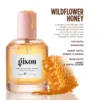 Wildflower Honey Hair Perfume beside honeycomb, with its mandarin, spring flower and honey scent notes